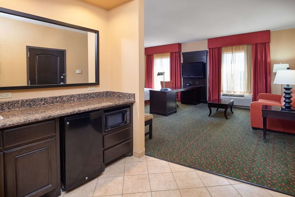 Step into a spacious suite with convenient in-room refreshment nook.