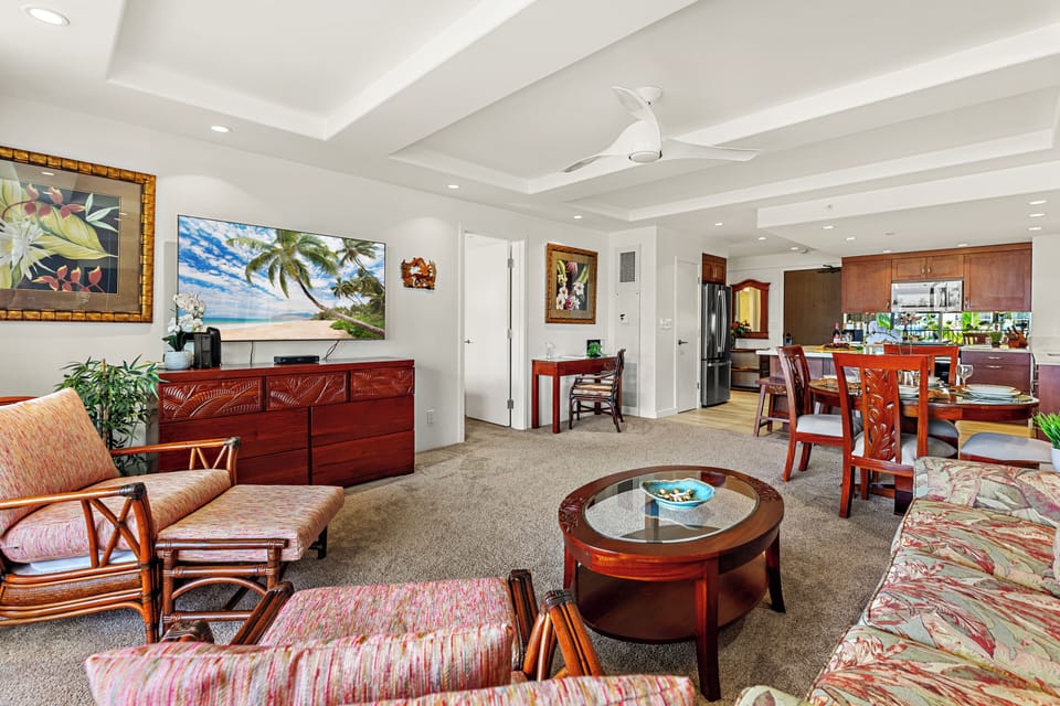 Unwind in a bright and welcoming living area, complete with a flat-screen TV and comfortable furnishings. Perfect for peaceful lounging.