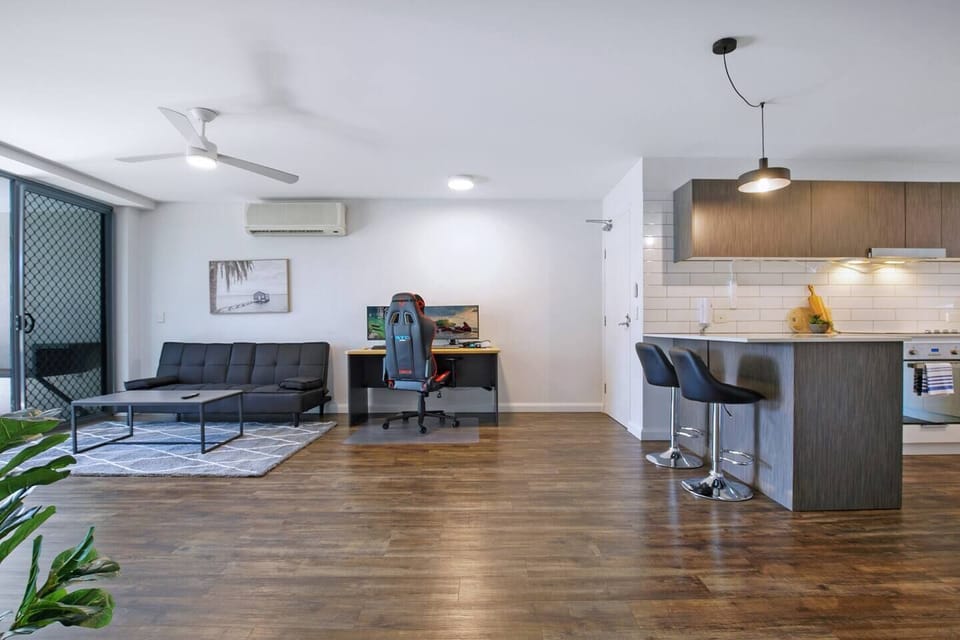 The living area comes with a dedicated workspace, perfect for those on a business trip.

