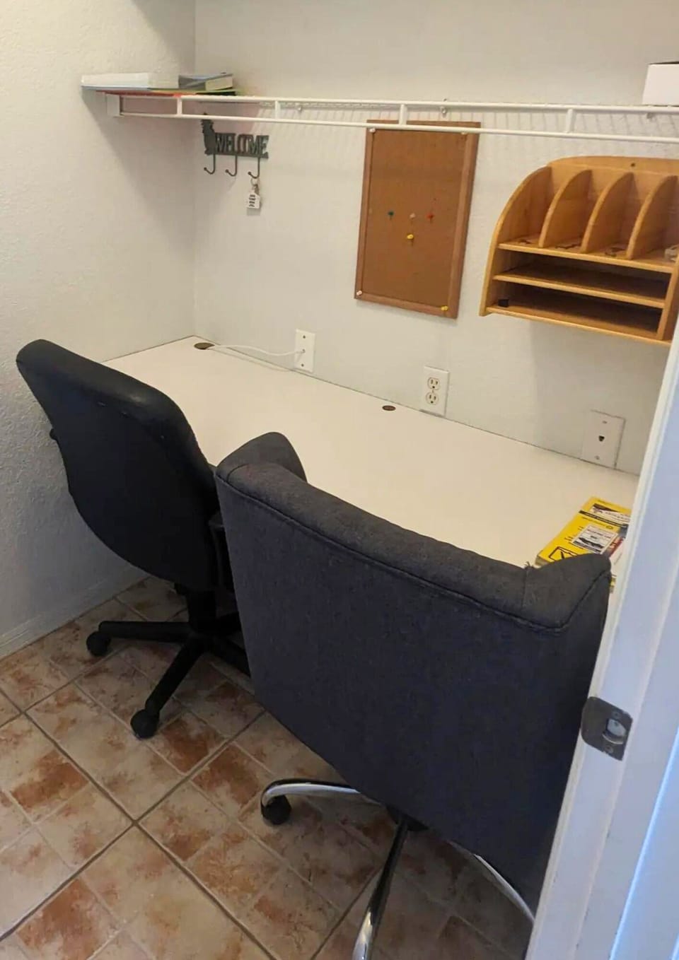 There's a designated workspace complete with a computer table and chairs.
