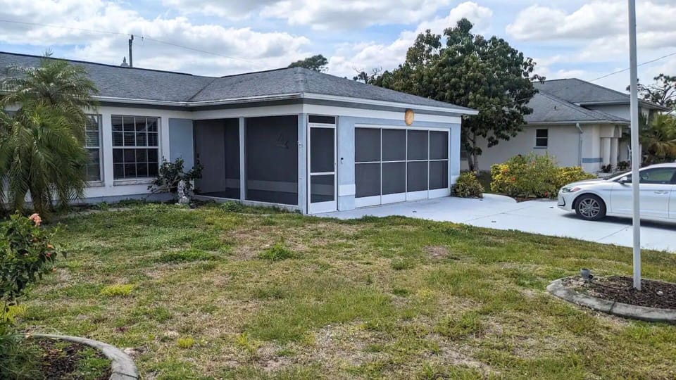 Front entrance with self-check-in smart lock, and 2 parking spaces available.