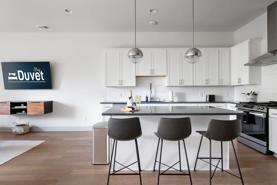 Fully Stocked Kitchen with Island Seating for 3