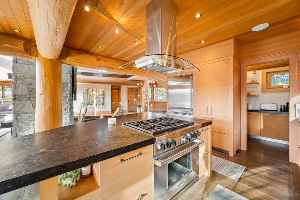 High spec kitchen with a pantry located in the back.