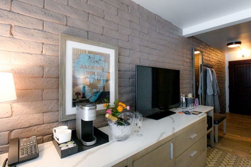 Modern living space with chic brick accent wall and warm lighting