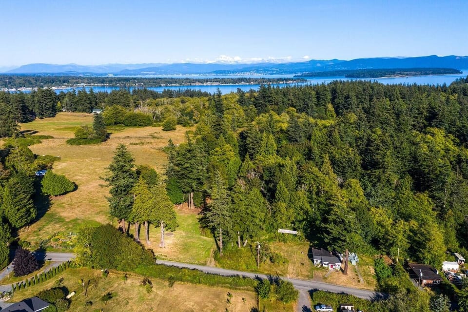 Miller's Island Retreat in foreground looking east toward Bellingham and Cascade Mountains.
