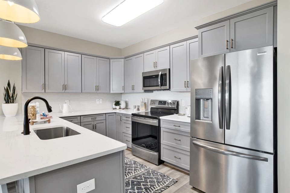 Stylish kitchen where stainless steel meets sleek design, inviting the creation of sumptuous meals and memories.