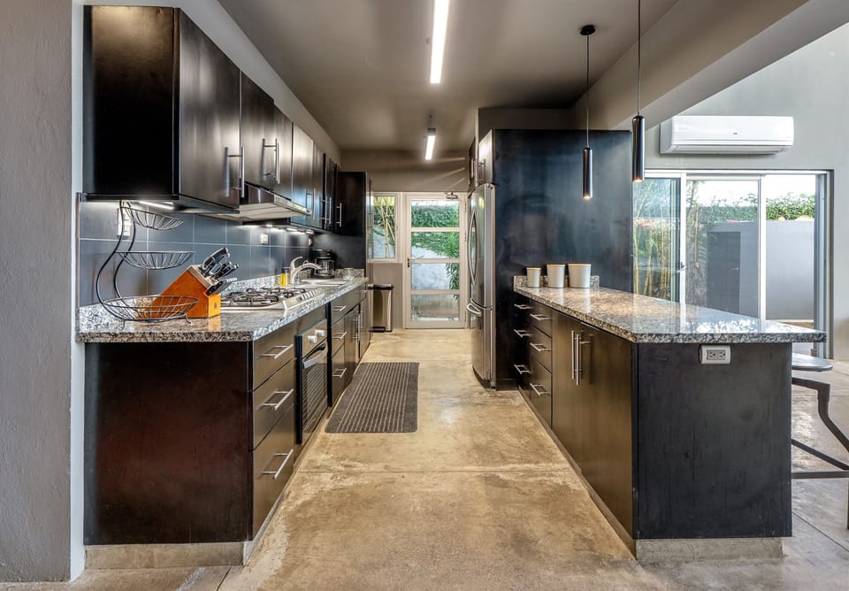 Fully equipped kitchen with modern appliances.