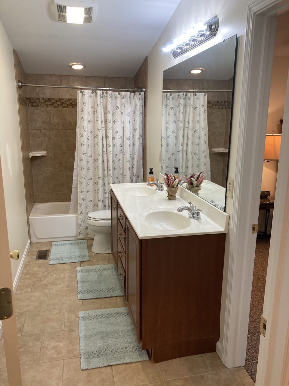 The Upstairs full bath is accessible by the mbr and loft by separate entrances