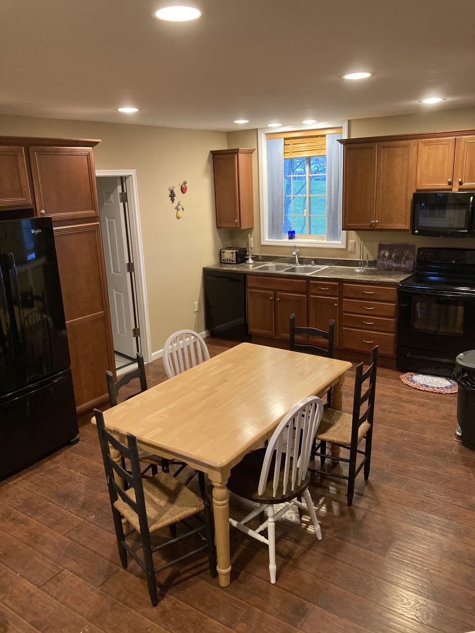 Kitchen has full appliances with kitchen table and chairs. Open to family room.