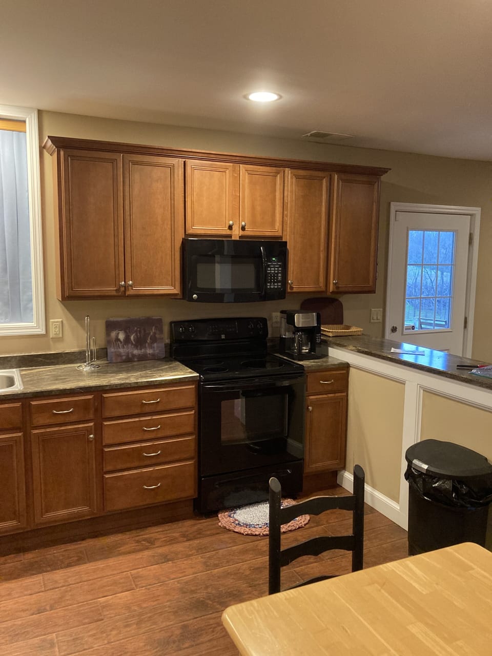 stove, fridge, microwa, coffee maker, toaster, pots/pans/ silverware and glasses
