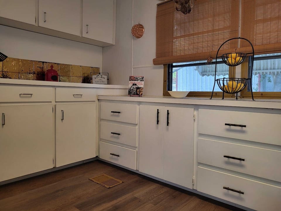 This spacious kitchen complete with cooking essentials.