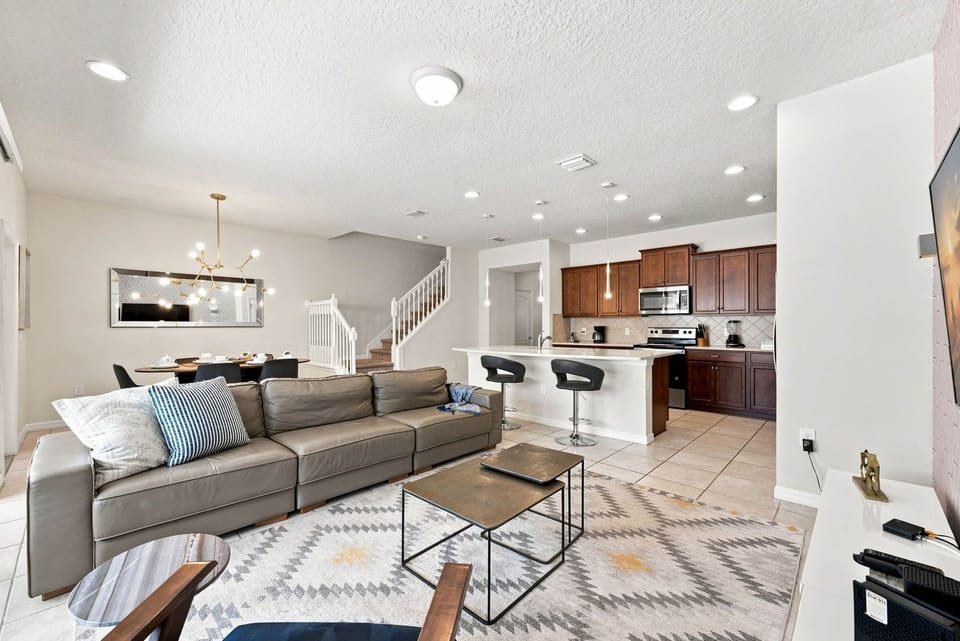 Spacious living room integrated with kitchen and dining area