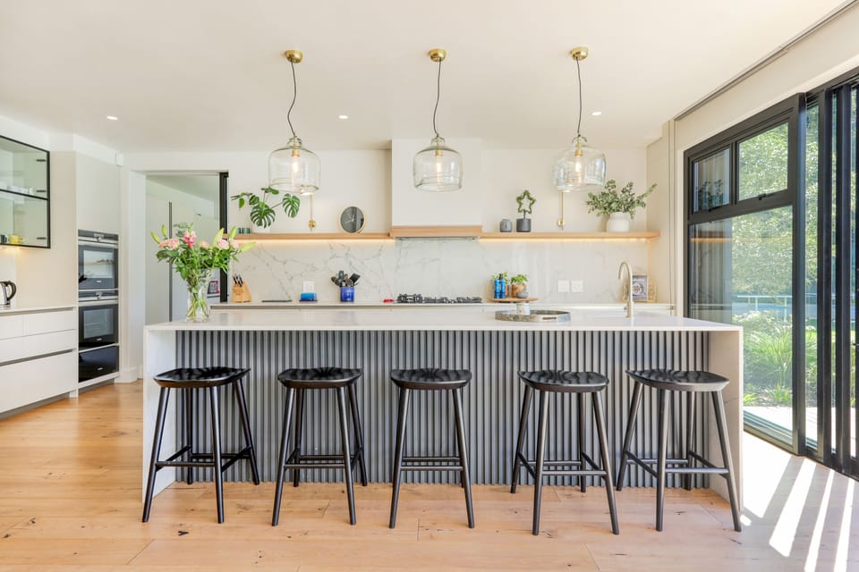Kitchen with gas top oven, warming drawers and all other essential appliances.