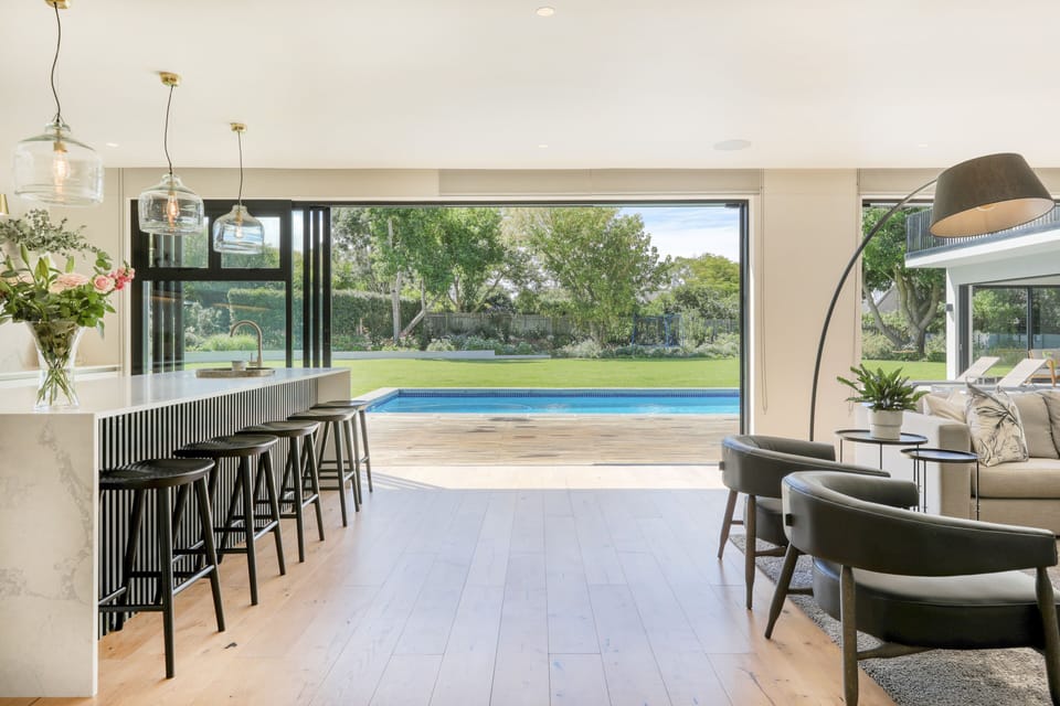 Front entrance to the kitchen and living area that all open out to pool deck.