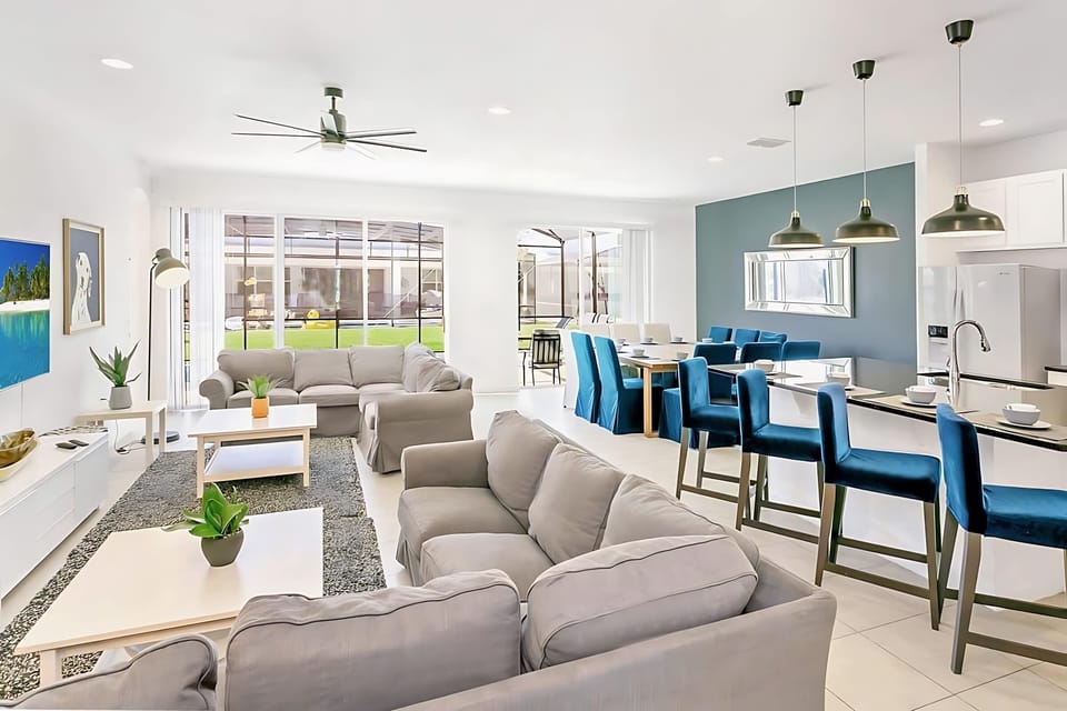 Bright Open Concept Living And Dining Area With Modern Furnishings