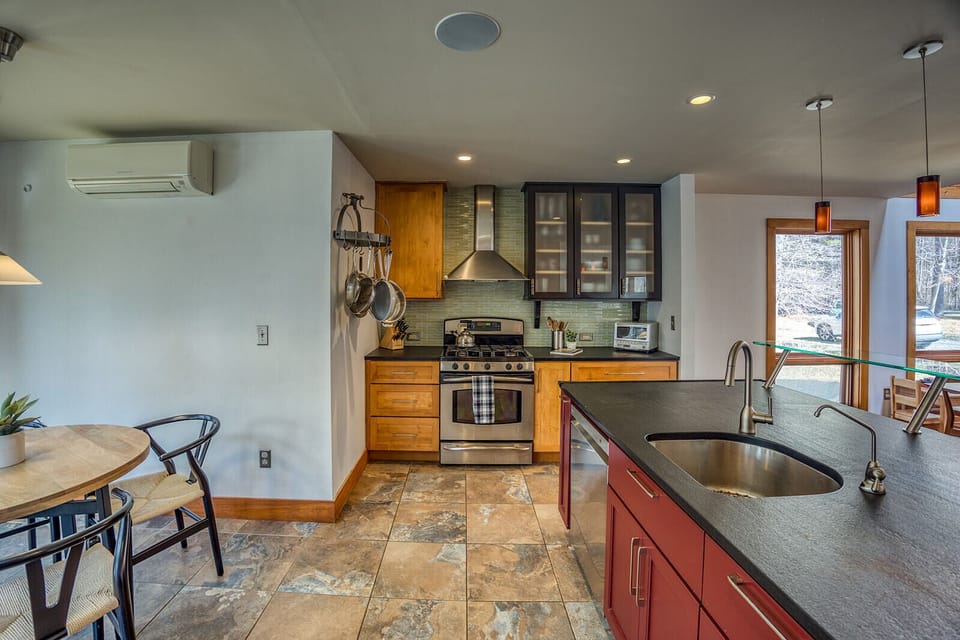 The spacious open kitchen comfortably accommodates seating for four, with an additional delightful kids' table for our younger guests to enjoy.