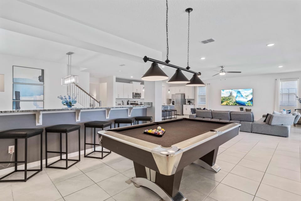 Keep the fun going with a pool table in the comfort of your vacation home in Kissimmee - Entertain guests with a game of pool in our inviting living space. - Enjoy hours of fun and laughter with your loved ones.