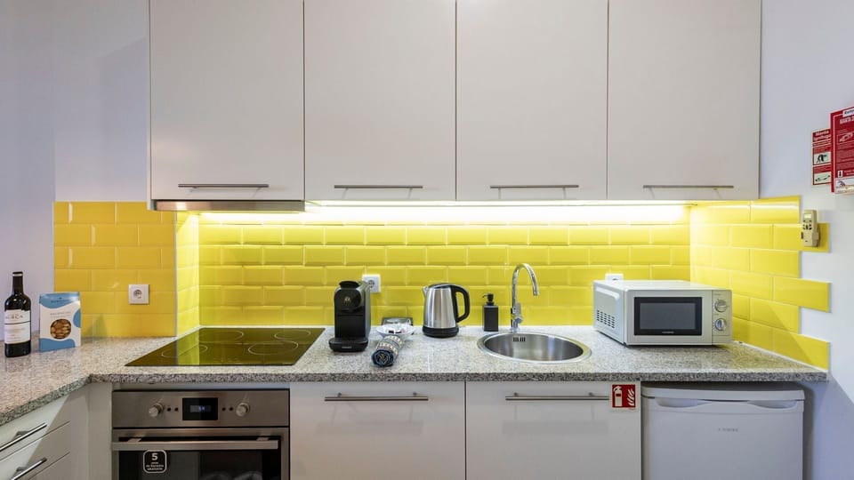 Our kitchenette is equipped with high-quality appliances #sleek #elegant