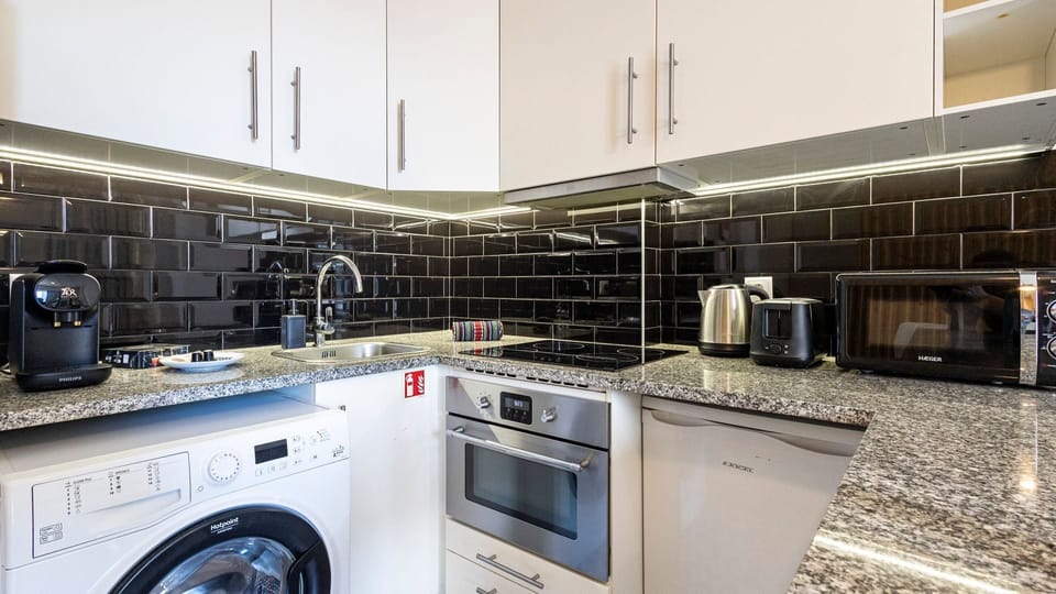 With modern appliances and tasteful design, our kitchenette is the perfect space to cook a delicious snack #practical #simple