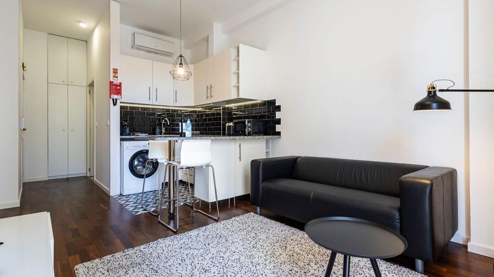 Discover the charm of our living area, adorned with unique accents and comfortable seating #contemporary #practical