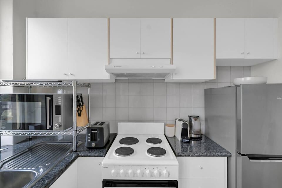 The compact kitchen comes with everything you’ll need to prepare a meal at home.
