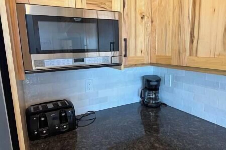 Kitchen toaster, microwave and coffee maker