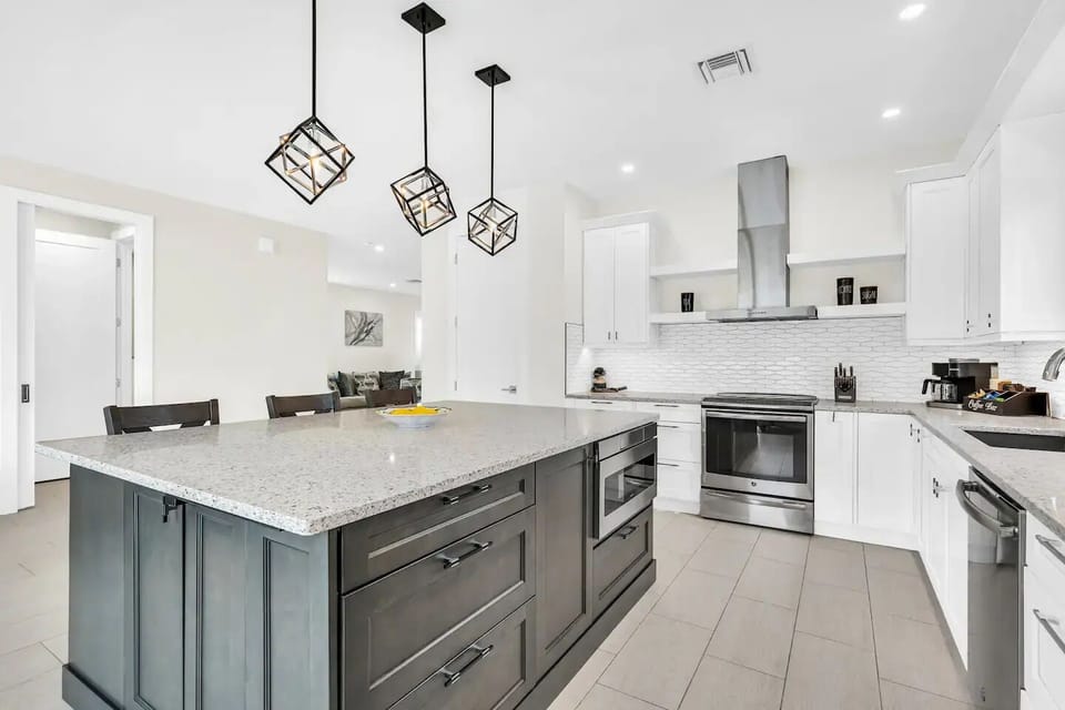 Ample counter space and an oversized kitchen island, a chef's dream!