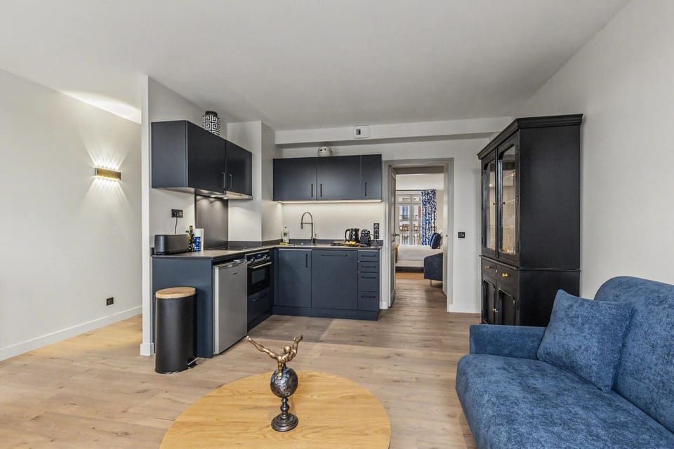 Warm living space combining lounge and kitchen for shared time.