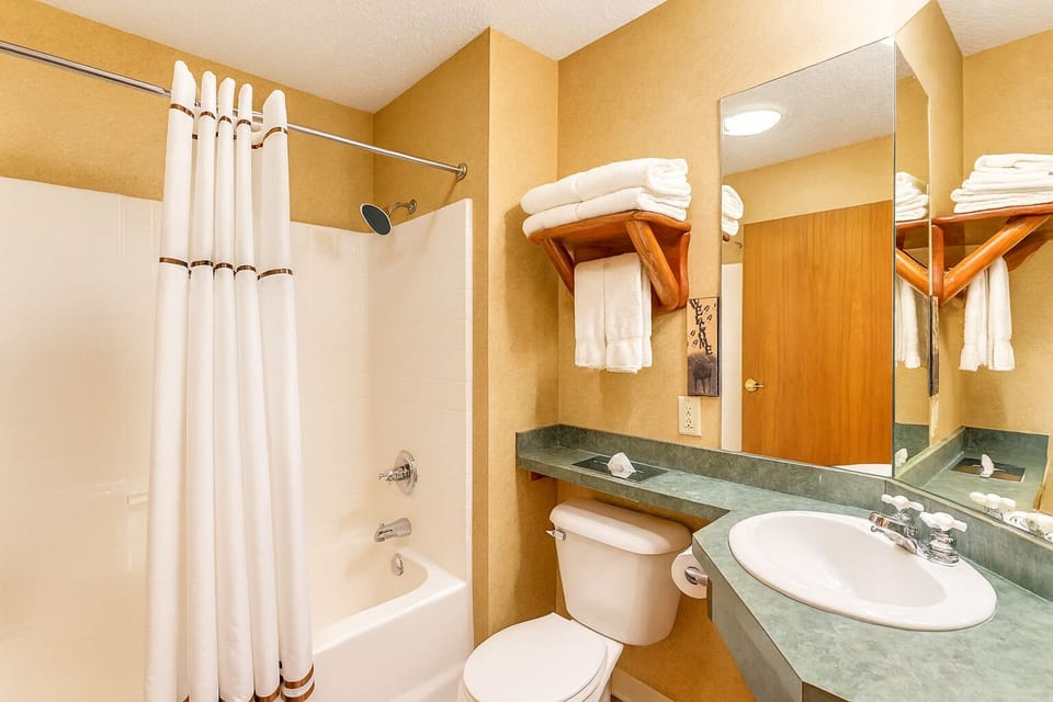 Refresh easily with a bright vanity and shower-tub combo.