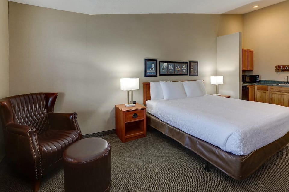 Recharge in a calm king bed, steps from handy kitchenette.