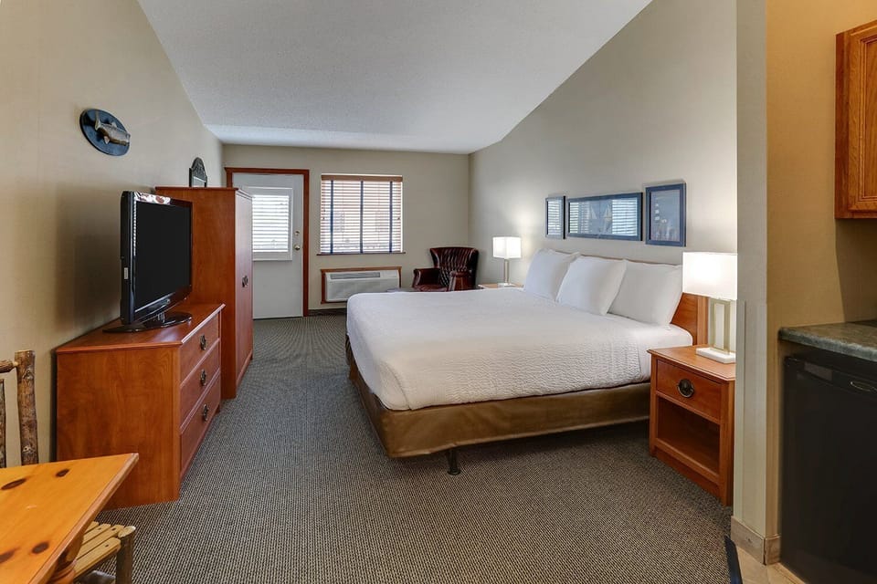 Stretch out in a spacious king room with seating and TV.