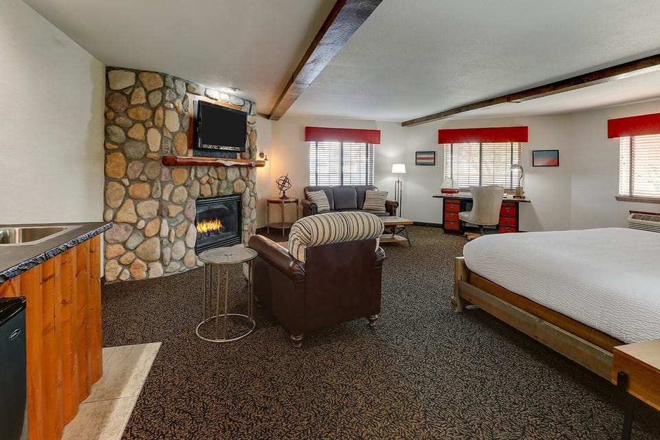 Gather in the suite’s lounge area by the fireplace.