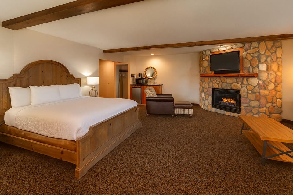Unwind beside the stone fireplace in your king suite.