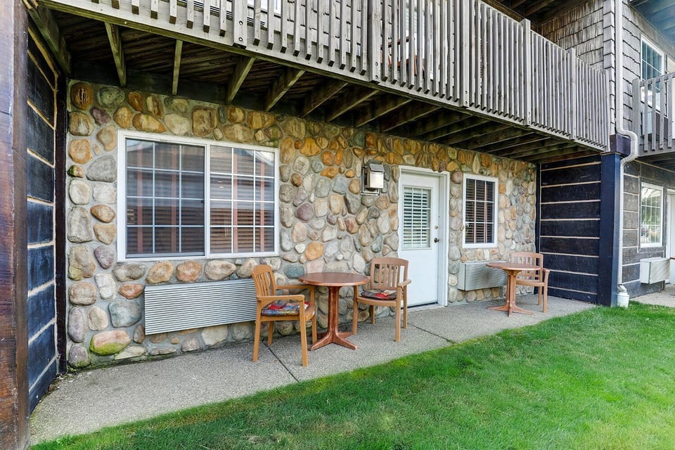 Sip coffee on the patio outside your stone-front room.
