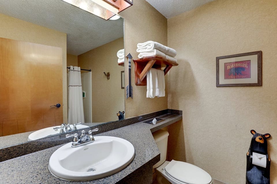 Refresh comfortably with bright vanity space and fresh towels.