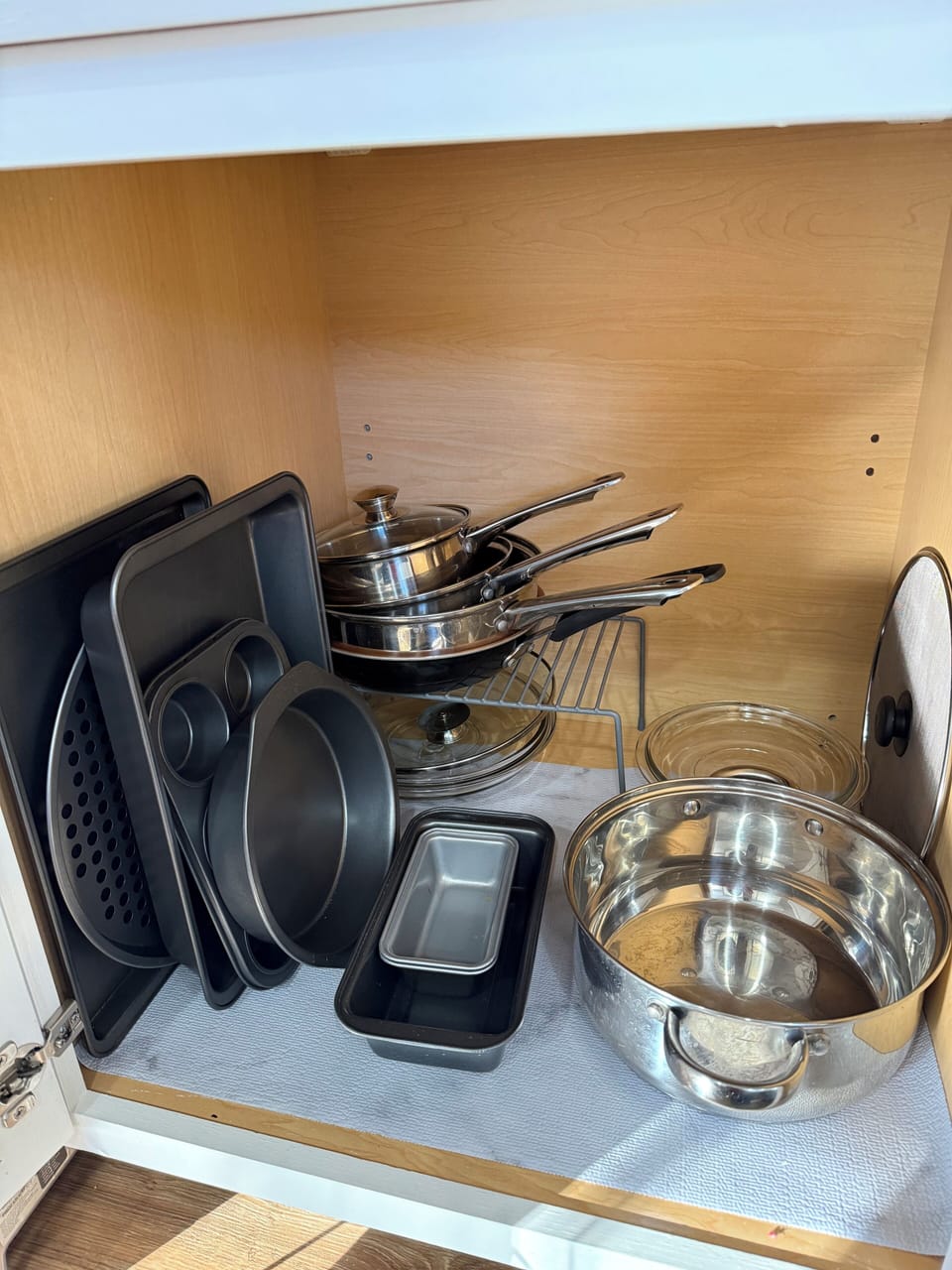 Plenty of bakeware, more pans and glass dishes in other cabinets