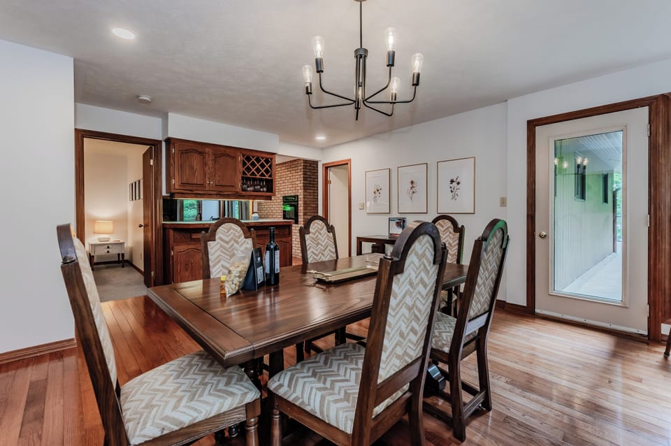 The dining room provides easy access to the upper deck, kitchen and living area.