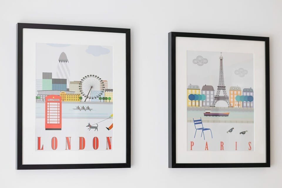 Framed modern artwork on the wall with a travel theme.