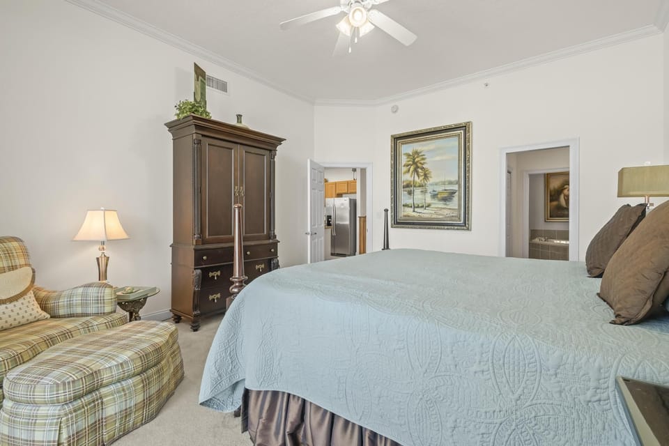 Primary Bedroom - The primary bedroom features exquisite, king bedding and a private bathroom.