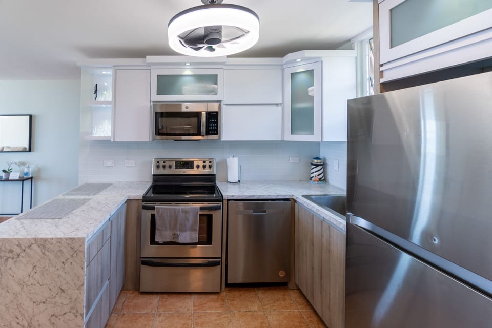 Fully equipped with modern appliances, cookware, and a beautiful view of the sea