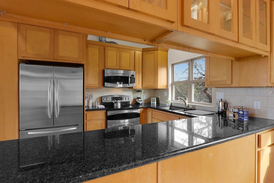 The breakfast bar in the kitchen opens up to the dining room