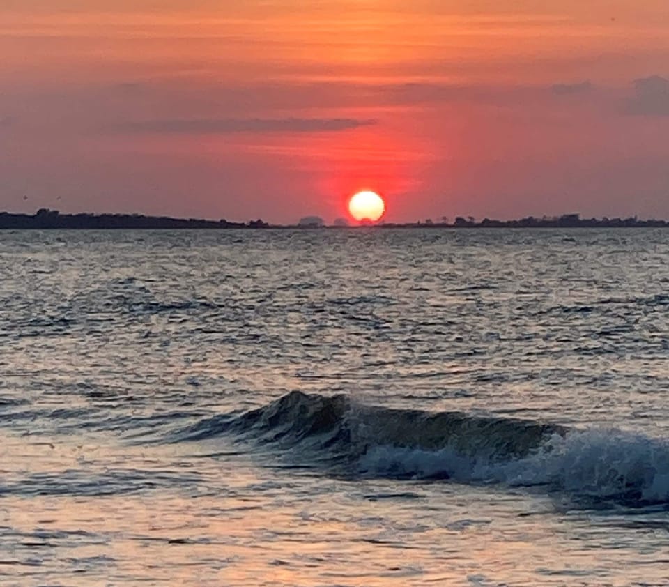Breezy Pelican - Sunset from the beach in front of the complex
