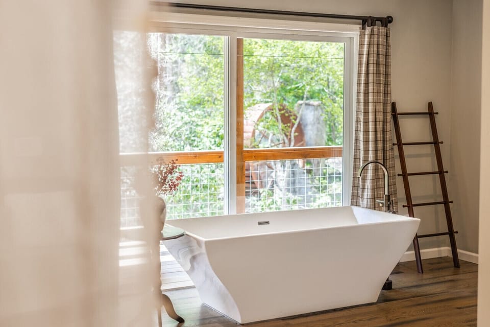 Where else can you soak next to a private waterfall?