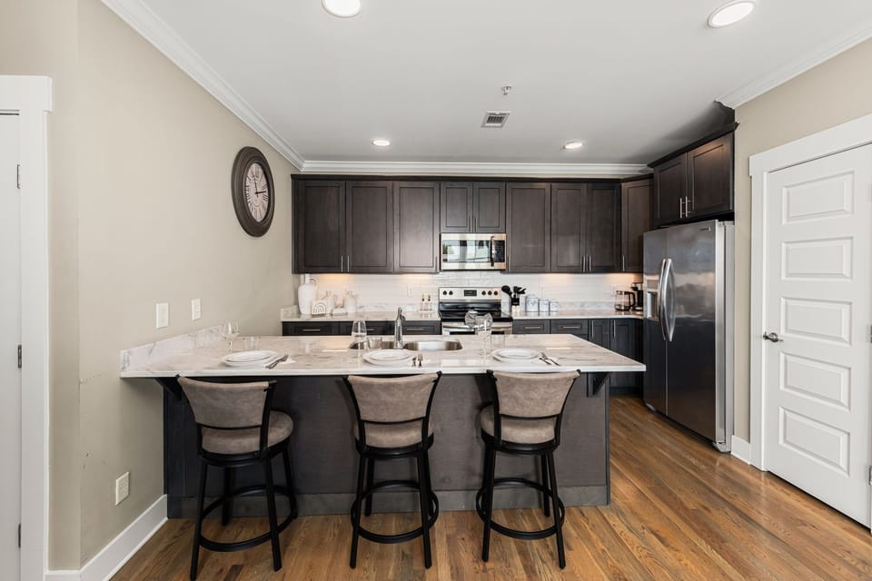 Kitchen offers bar seating for three