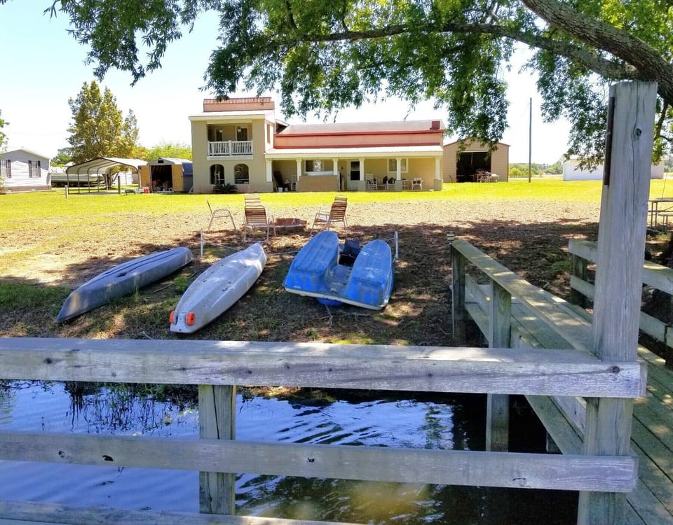 Lakeside of house.  Large yard.
Peddle boat and kayaks for added fun!