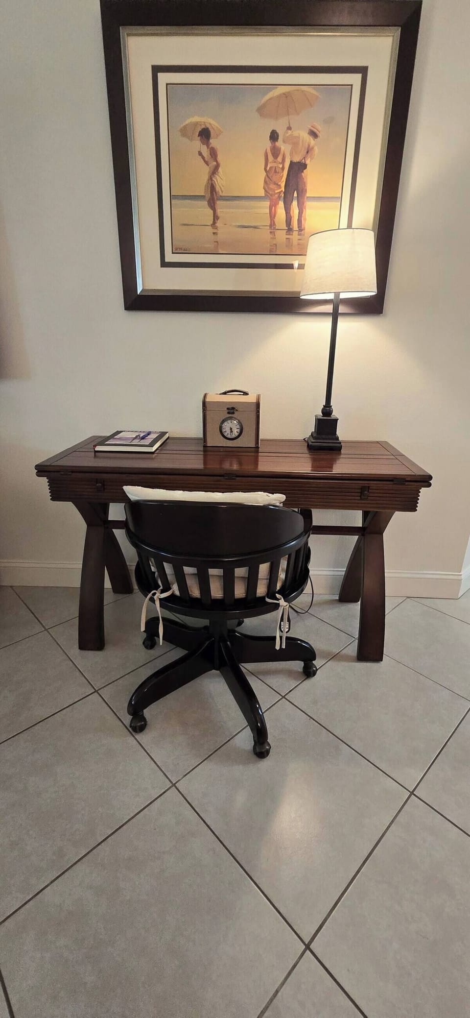 Dedicated workspace with desk and chair in the living area.