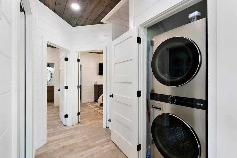 Off the kitchen is the laundry closet as well as both Master Suites!