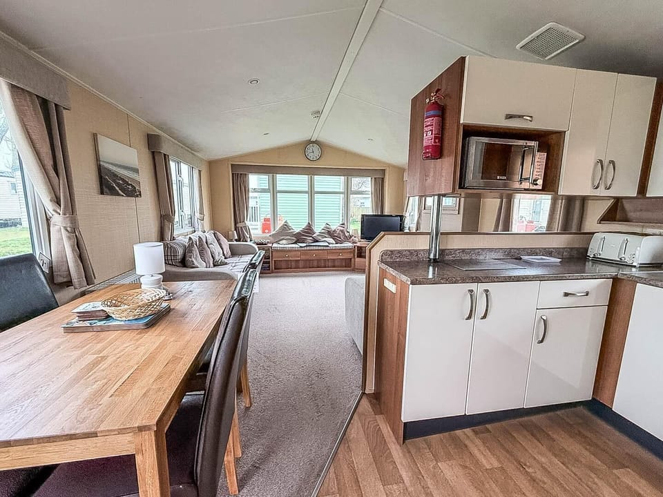 The kitcehn with adjacent table is the perfect palce to get everyone together for dinner. Afterwards get the board games out for a fun family night in.