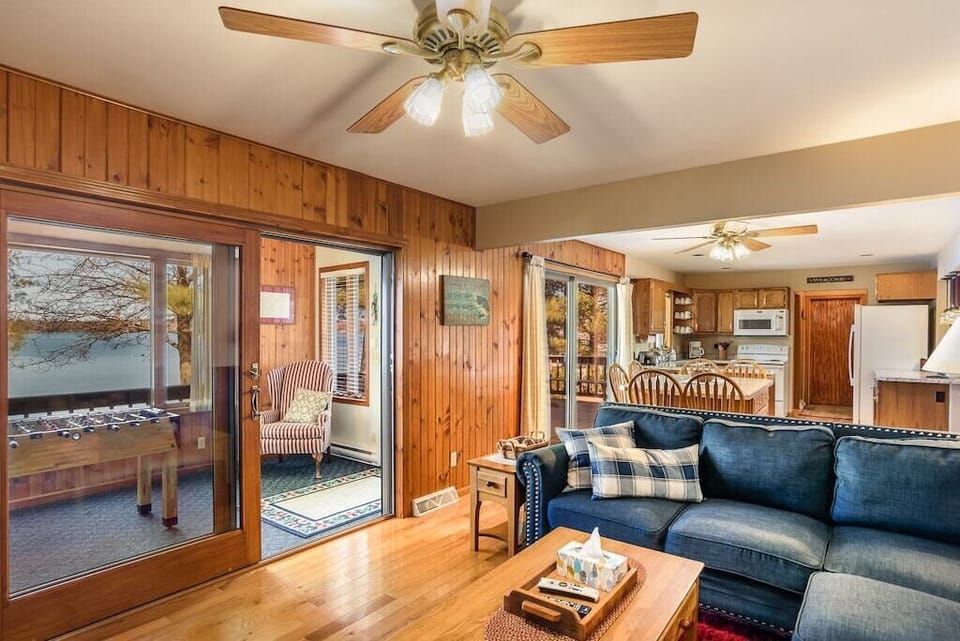 Living room with doorway to the sunporch overlooking the lake.