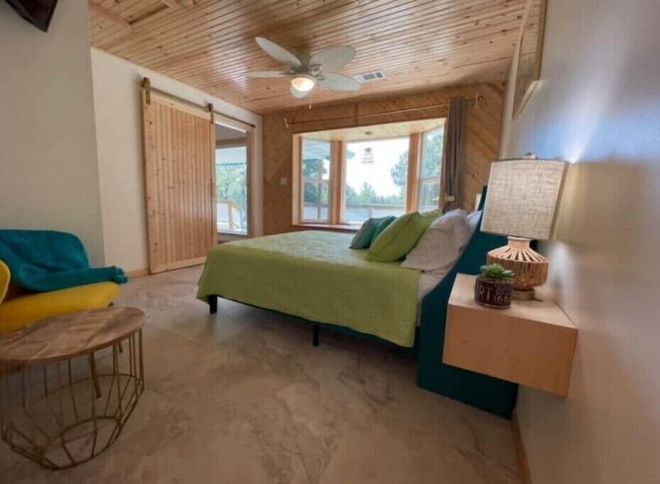 Bedroom 1 offers a TV, full bed, ensuite bathroom and bay window reading nook.
